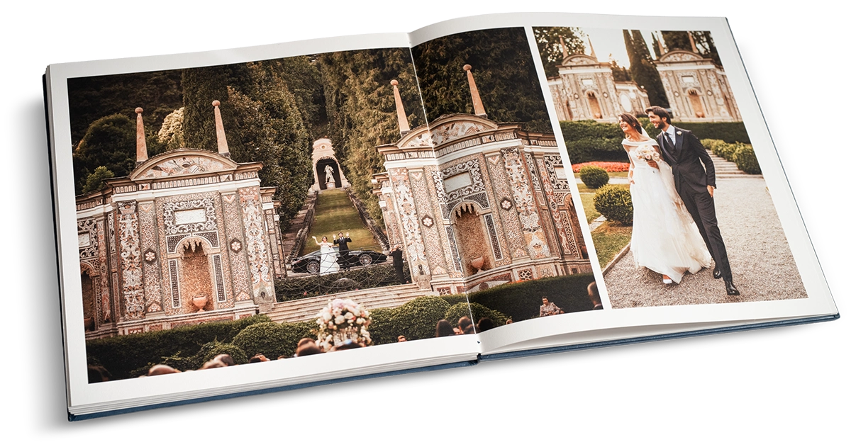 Album matrimoniale Fine Art aperto con rilegatura layflat panoramica che mostra la continuità dell'immagine su carta cotone